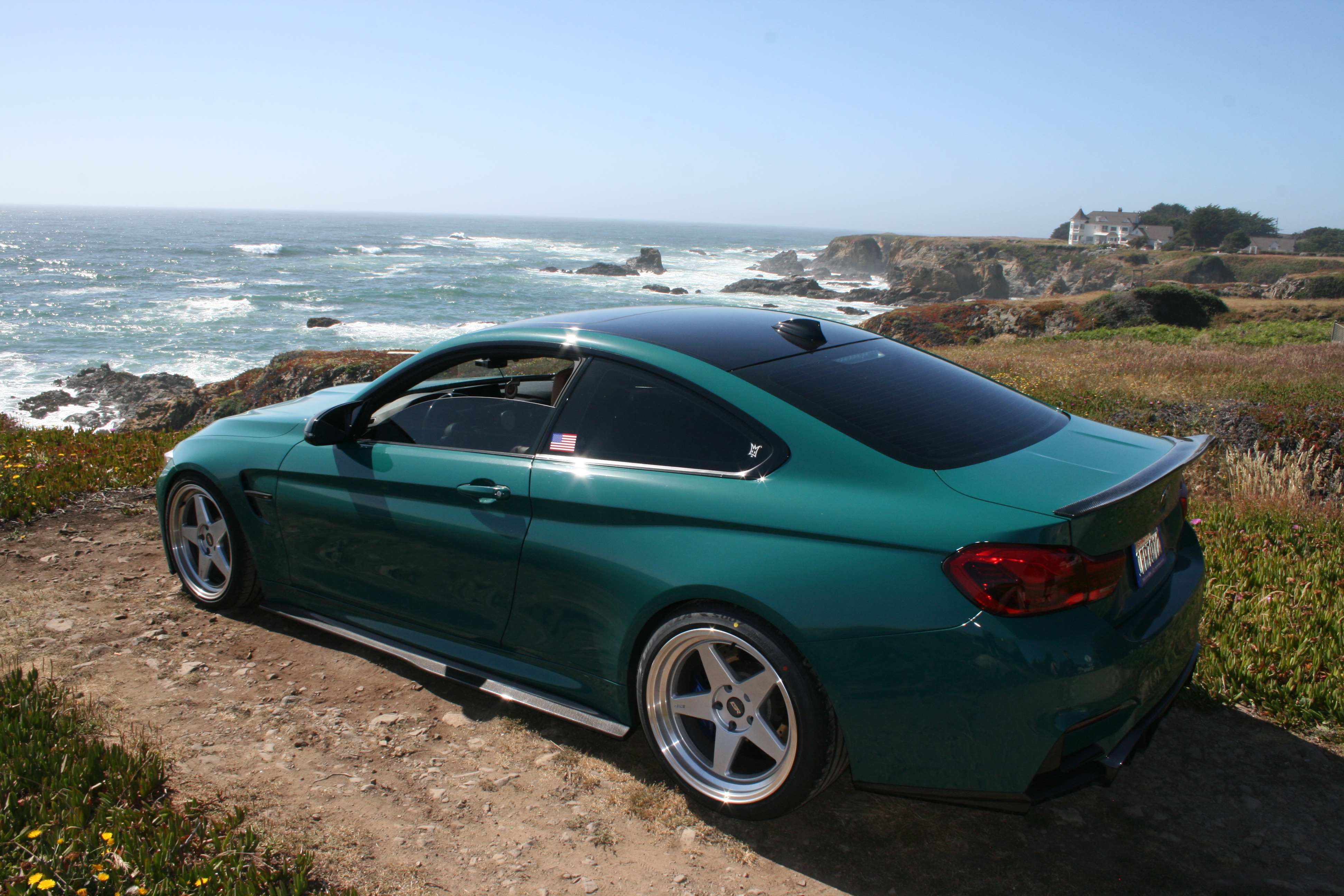 BMW 4 Series in teal Inozetek wrap at the coast