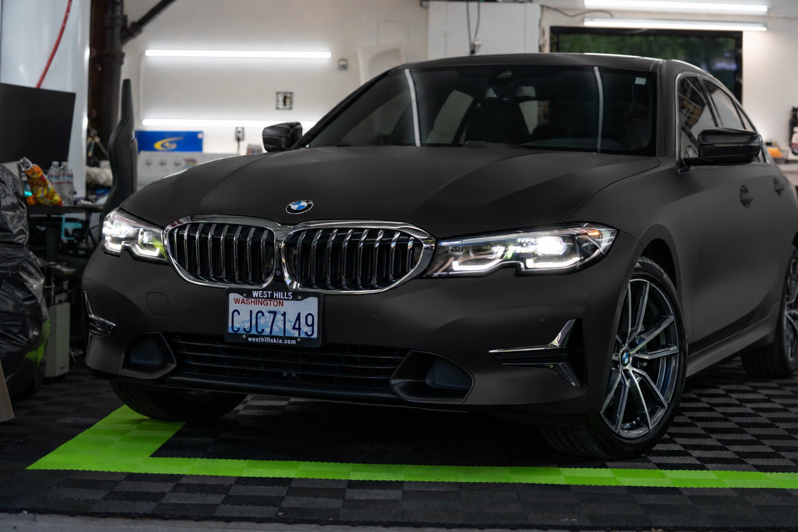 The same BMW 330i wrapped in a matte finish by SeaWraps, with every reflection flattened out