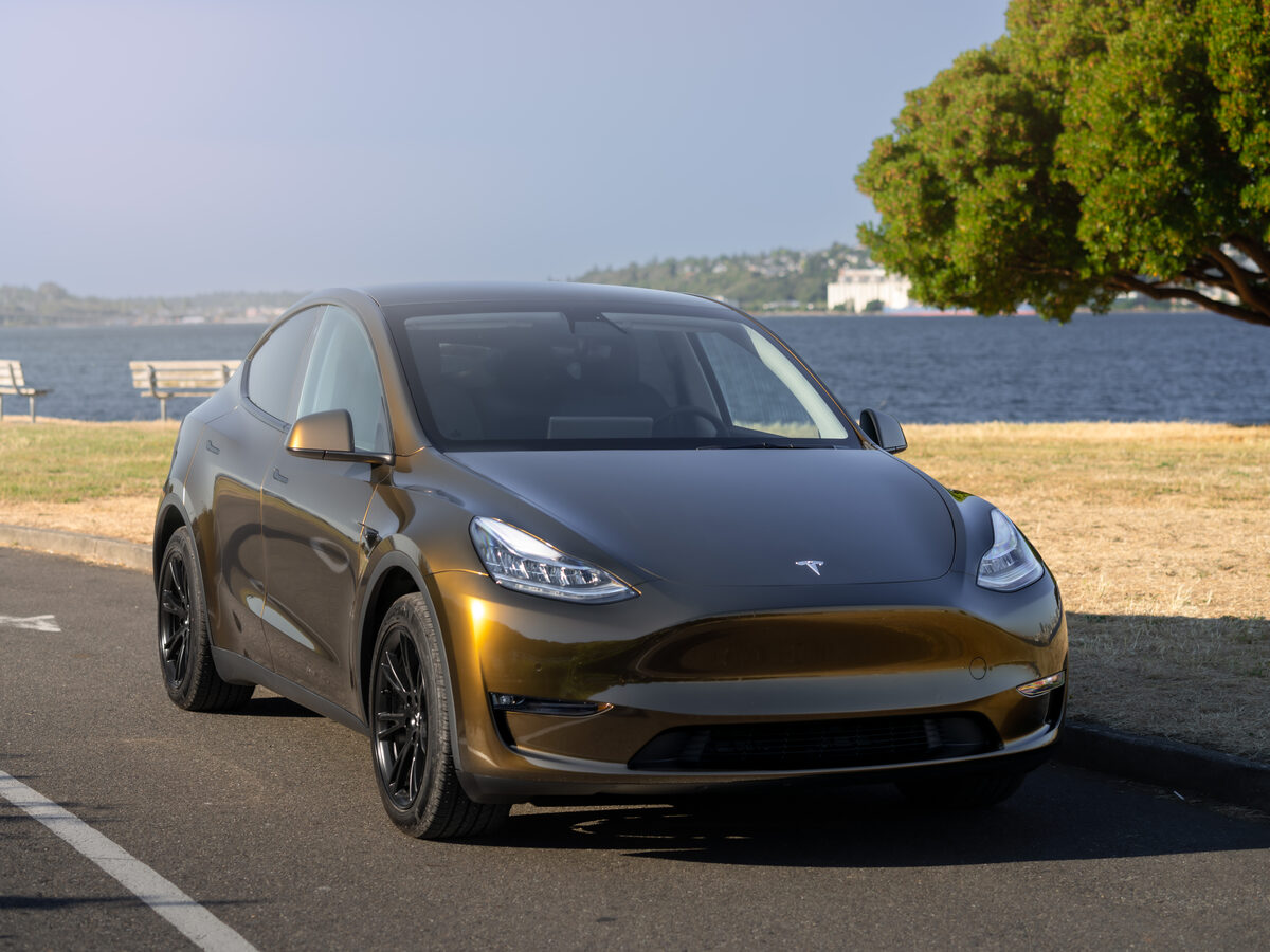 Tesla Model Y Gloss Metallic Midnight Gold wrap by SeaWraps