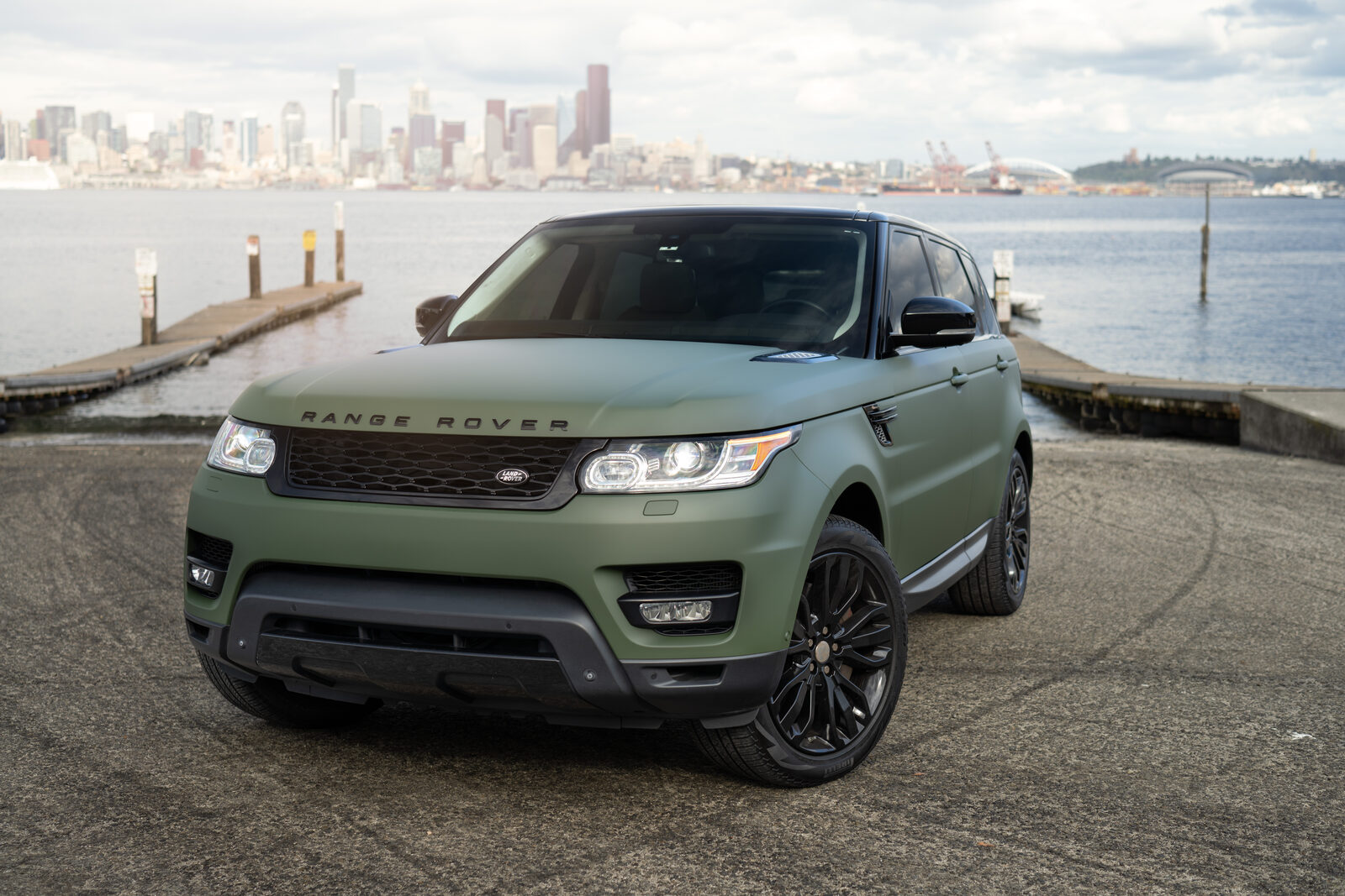 Land Rover Discovery in a green wrap by SeaWraps, front three-quarter view