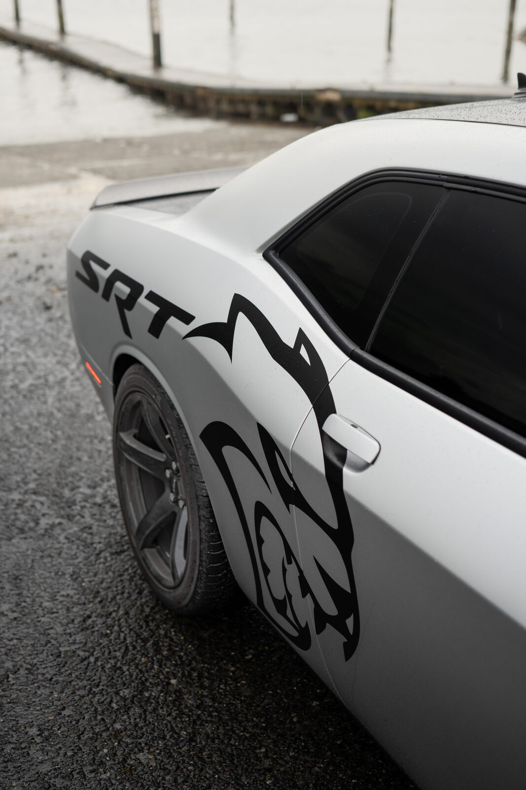 Panel edge and shut line detail on a wrapped Dodge Challenger at the SeaWraps shop in Kent
